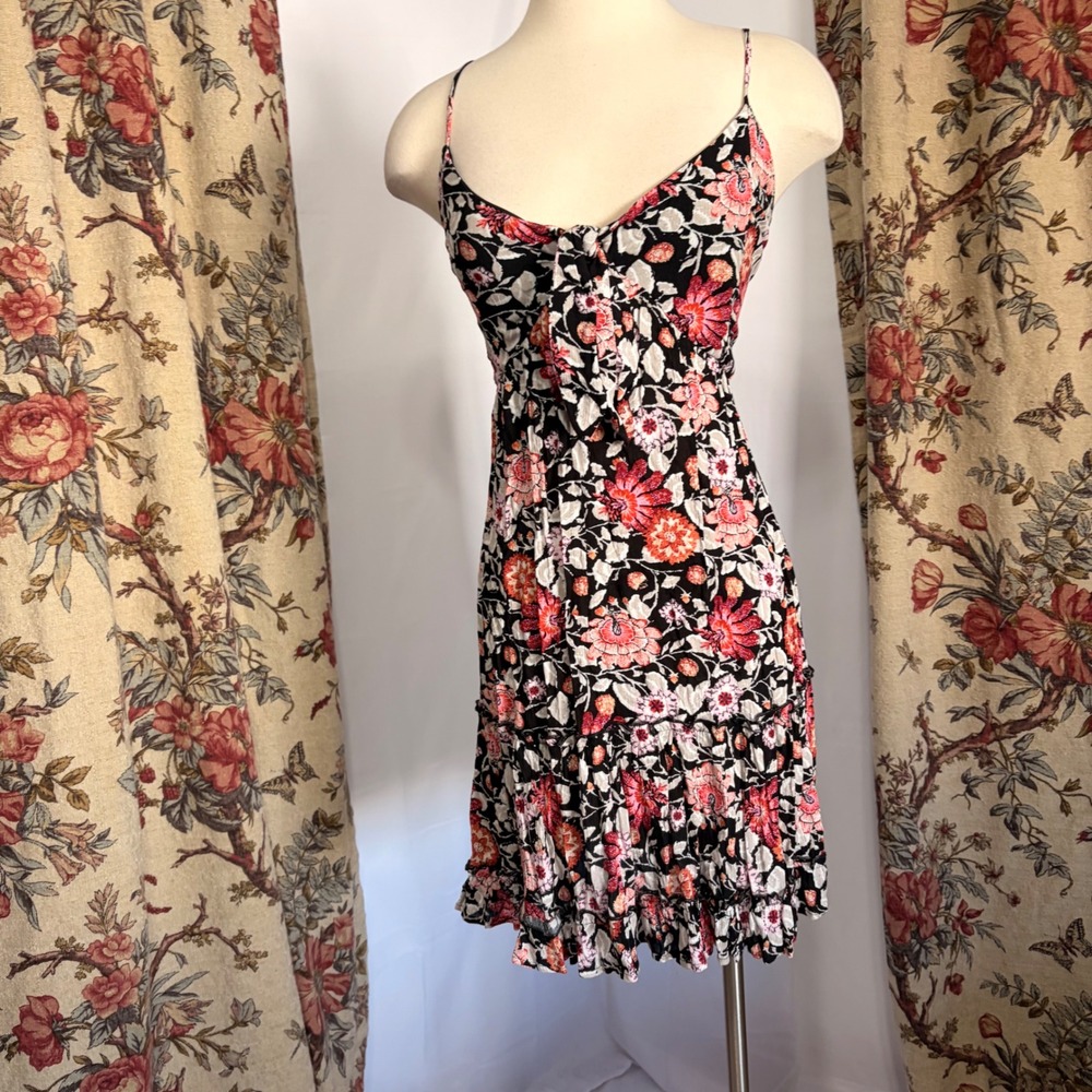 Maurices Adorable Black flowy mini dress with warm toned floral detailing